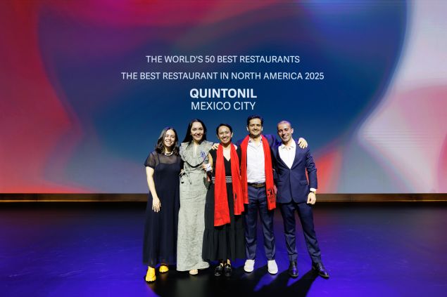 The Quintonil team celebrates on stage at The World’s 50 Best Restaurants 2025, having won Best Restaurant in North America, with “QUINTONIL MEXICO CITY” displayed behind them.